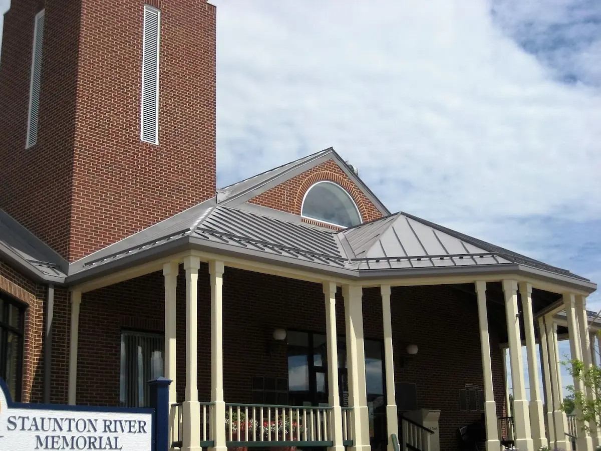 Skilled roofing craftsmen working on a residential roof in Inwood-Northwest